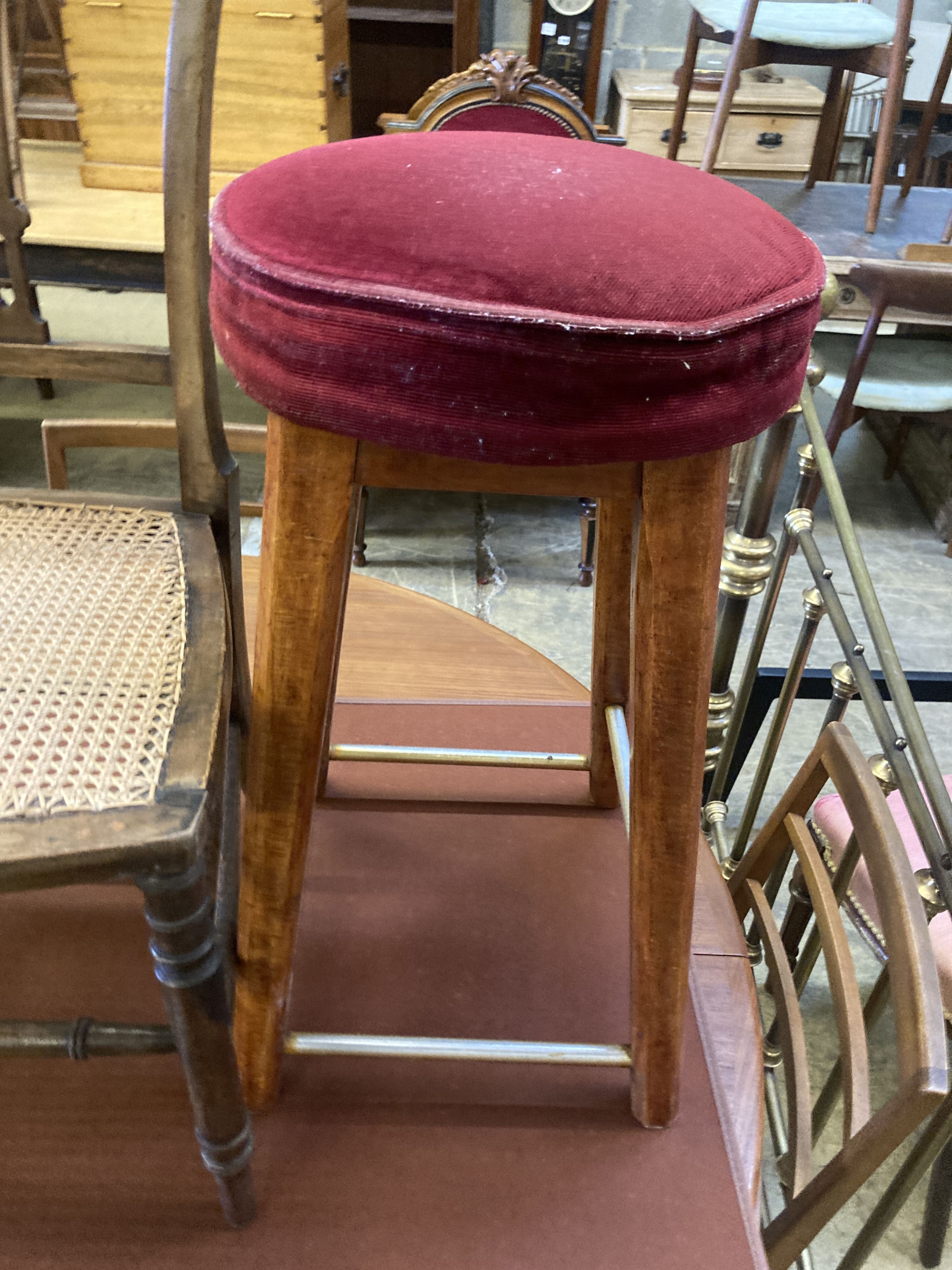 An Edwardian cane seat chair and a pair of beech stools